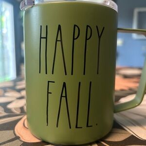 Green Rae Dunn coffee mug with lid.